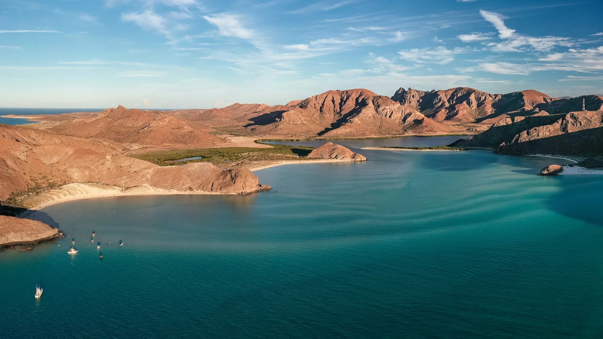 Sunny February day on the La Paz waterfront with calm turquoise Sea of Cortez and desert hills