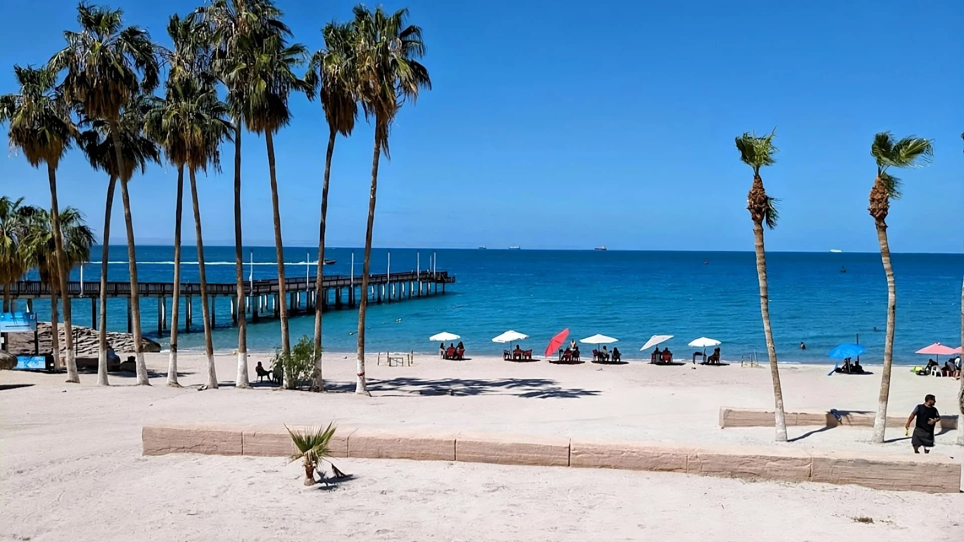 Hot sunny May day on Playa Balandra near La Paz with warm turquoise shallows and desert hills